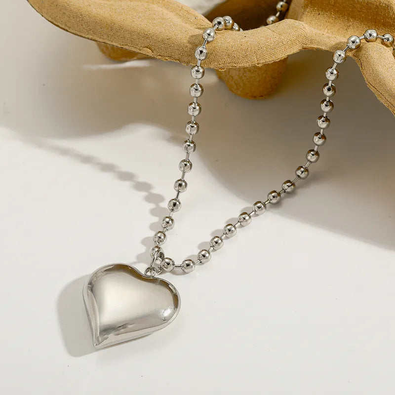Silver heart-shaped pendant necklace