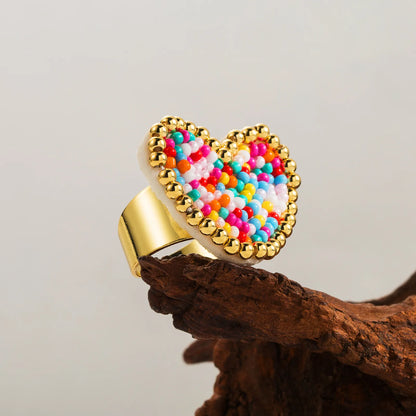 Heart-shaped ring with colorful beads