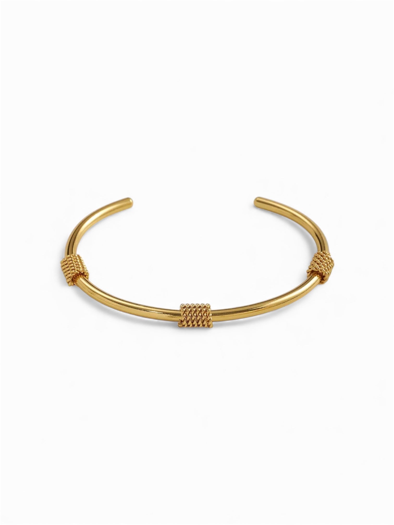 Gold bracelet on a white background